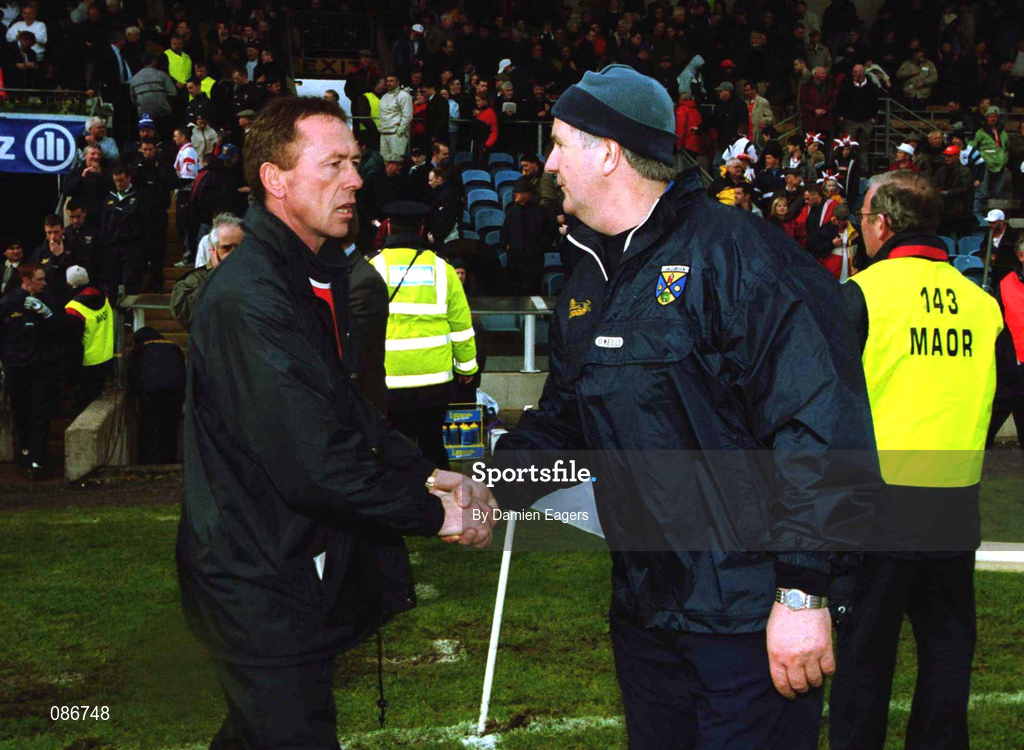 28 April 2002; Tyrone co-manager Eugene McKenna, left, shakes hands with Cavan manager Mattie Kerrigan, after the Allianz National Football League Division 1 Final match between Tyrone and Cavan at St Tiernach's Park in Clones, Monaghan. Photo by Damien Eagers/Sportsfile