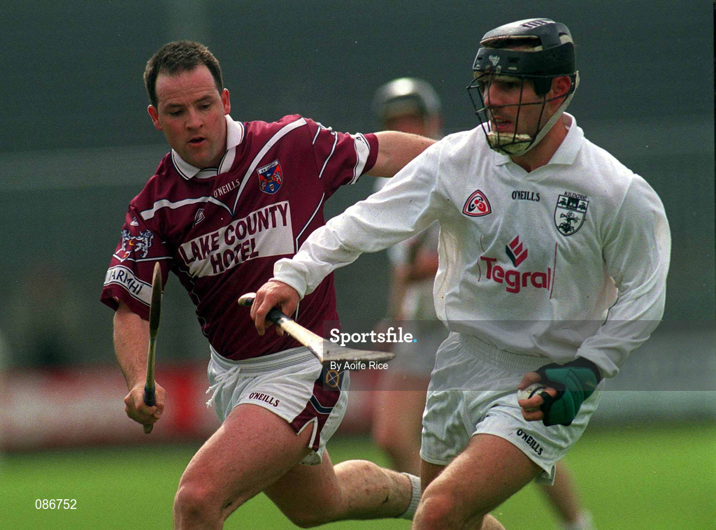 28 April 2002; Tony Spain of Kildare is tackled by Alfie Devine of Westmeath during the Guinness Leinster Senior Hurling Championship First Round match between Westmeath and Kildare at Cusack Park in Mullingar, Westmeath. Photo by Aoife Rice/Sportsfile