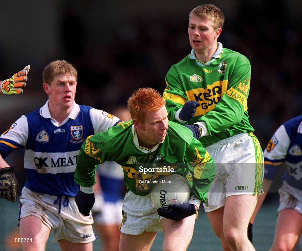 28 April 2002; Séamus Scanlon of Kerry, supported by team-mate Tomás Ó Sé, is challenged by Brian McDonald of Laois during the Allianz National Football League Division 2 Final match between Kerry and Laois at the Gaelic Grounds in Limerick. Photo by Brendan Moran/Sportsfile