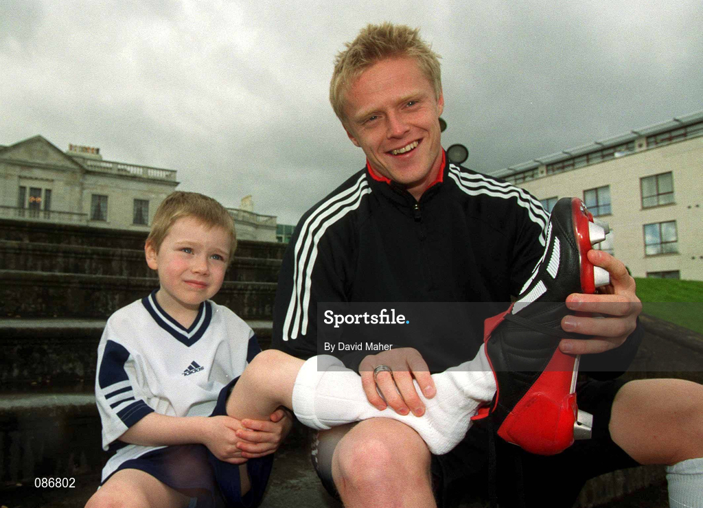 29 April 2002; Republic of Ireland International Damien Duff with 5 year old Liam Scully, from Swords, at the launch of The adidas Predator Mania football boot at The Radisson Hotel in Dublin. Photo by David Maher/Sportsfile