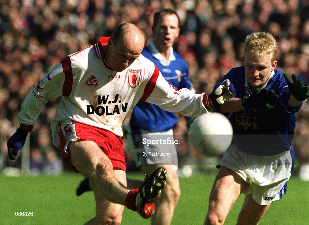 28 April 2002; Peter Canavan of Tyrone in action against Michael Brides of Cavan during the Allianz National Football League Division 1 Final match between Tyrone and Cavan at St Tiernach's Park in Clones, Monaghan. Photo by Pat Murphy/Sportsfile
