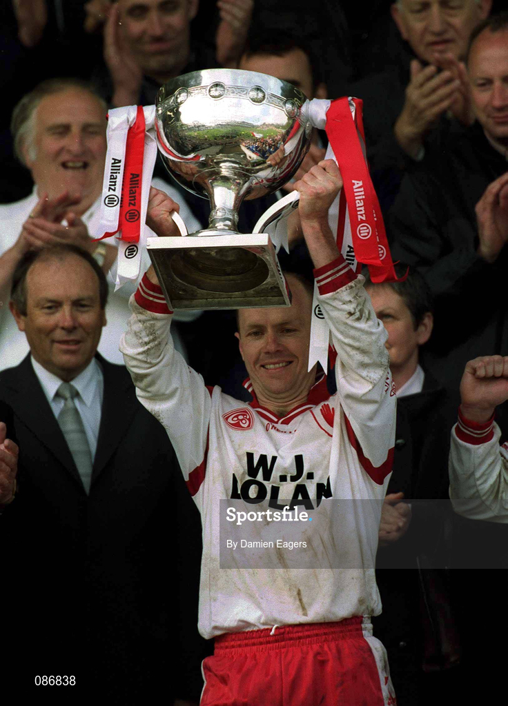 28 April 2002; Tyrone captain Peter Canavan lifts the cup prior to the Allianz National Football League Division 1 Final match between Tyrone and Cavan at St Tiernach's Park in Clones, Monaghan. Photo by Damien Eagers/Sportsfile