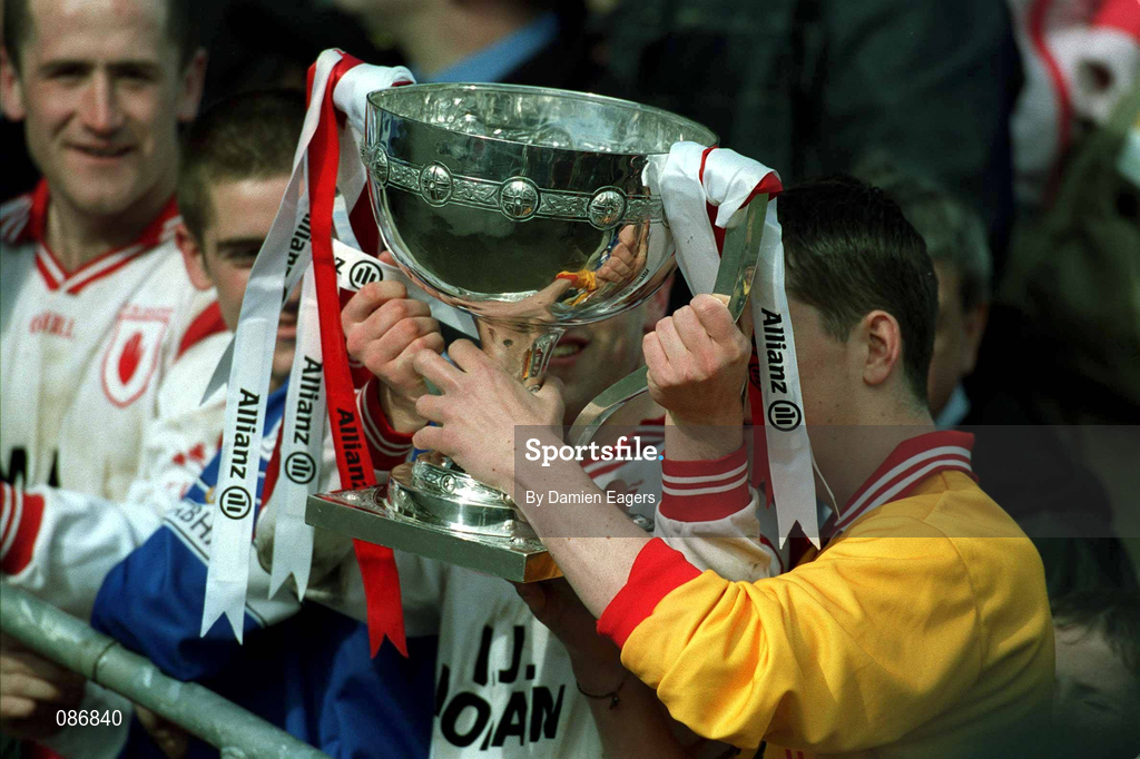 28 April 2002; Tyrone players celebrate with the cup after the Allianz National Football League Division 1 Final match between Tyrone and Cavan at St Tiernach's Park in Clones, Monaghan. Photo by Damien Eagers/Sportsfile