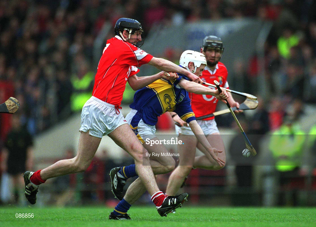 21 April 2002; Seamus Butler of Tipperary in action against Pat Mulcahy of Cork during the Allianz National Hurling League Semi-Final match between Cork and Tipperary at Páirc Uí Chaoimh in Cork. Photo by Ray McManus/Sportsfile