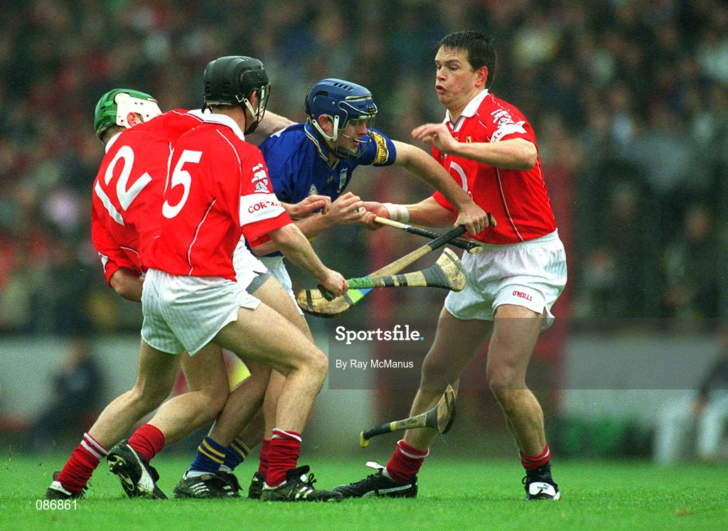 21 April 2002; Paul Kelly of Tipperary is challenged by Cork players, from left, Niall McCarthy, Ben O'Connor and Alan Browne during the Allianz National Hurling League Semi-Final match between Cork and Tipperary at Páirc Uí Chaoimh in Cork. Photo by Ray McManus/Sportsfile