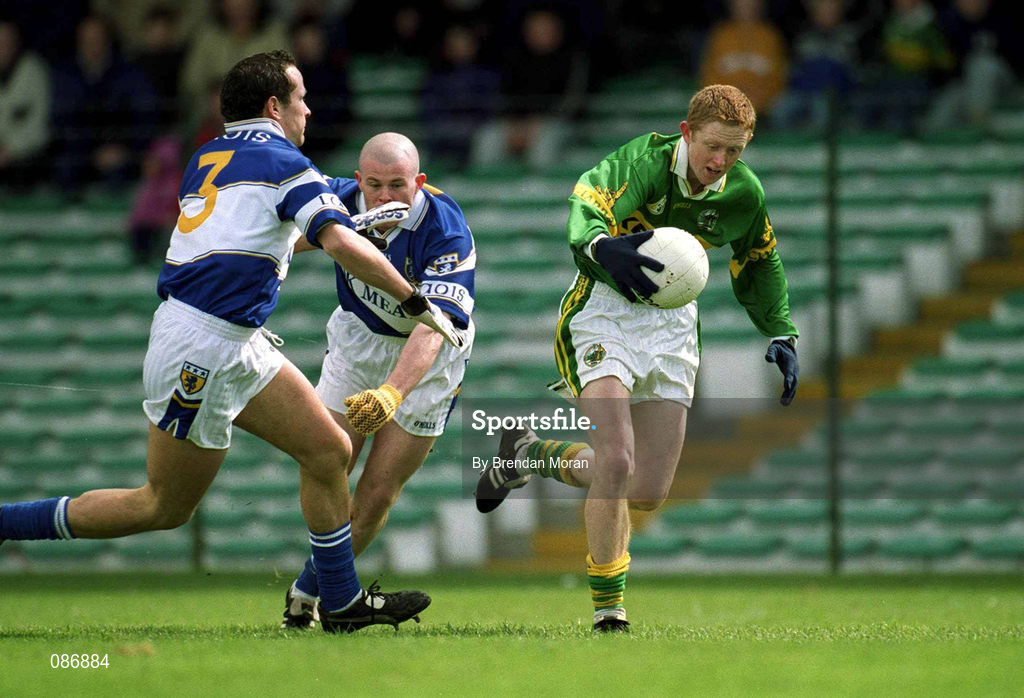28 April 2002; Colm Cooper of Kerry goes past the challenge of Laois defenders Tom Kelly and Pauraic Leonard, left, on his way to scoring his side's first goal during the Allianz National Football League Division 2 Final match between Kerry and Laois at the Gaelic Grounds in Limerick. Photo by Brendan Moran/Sportsfile
