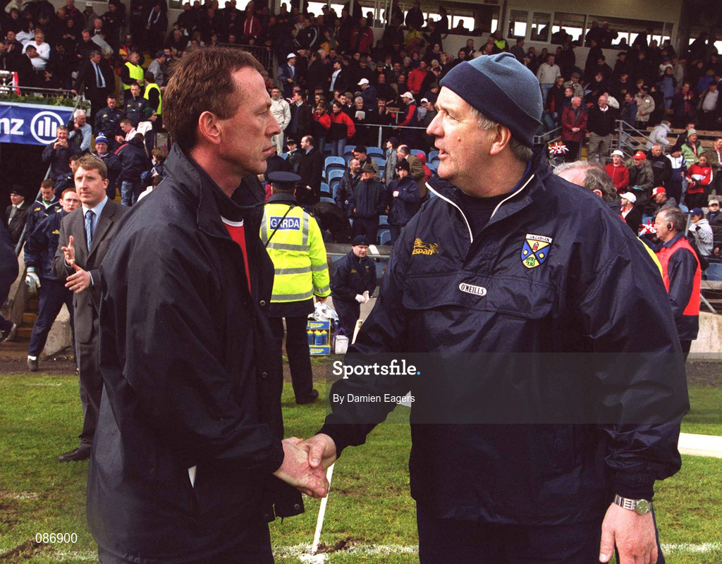 28 April 2002; Tyrone co-manager Eugene McKenna, left, shakes hands with Cavan manager Mattie Kerrigan, after the Allianz National Football League Division 1 Final match between Tyrone and Cavan at St Tiernach's Park in Clones, Monaghan. Photo by Damien Eagers/Sportsfile