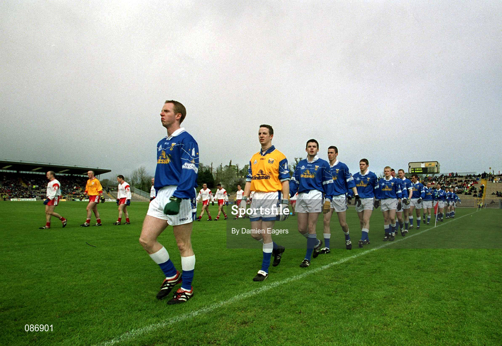 28 April 2002; Cavan captain Anthony Forde leads his team in the parade prior to the Allianz National Football League Division 1 Final match between Tyrone and Cavan at St Tiernach's Park in Clones, Monaghan. Photo by Damien Eagers/Sportsfile