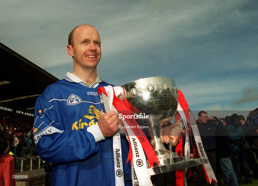 28 April 2002; Tyrone captain Peter Canavan, wearing a Cavan jersey, celebrates with the cup after the Allianz National Football League Division 1 Final match between Tyrone and Cavan at St Tiernach's Park in Clones, Monaghan. Photo by Damien Eagers/Sportsfile
