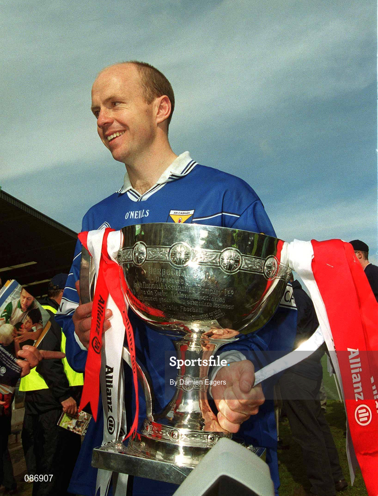 28 April 2002; Tyrone captain Peter Canavan, wearing a Cavan jersey, celebrates with the cup after the Allianz National Football League Division 1 Final match between Tyrone and Cavan at St Tiernach's Park in Clones, Monaghan. Photo by Damien Eagers/Sportsfile