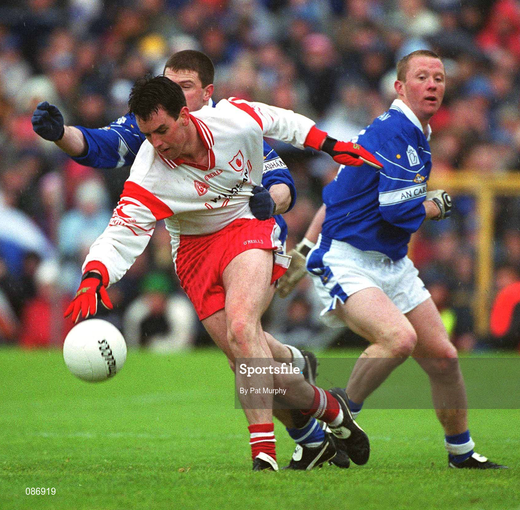 28 April 2002; Brian Robinson of Tyrone in action against Larry Reilly of Cavan during the Allianz National Football League Division 1 Final match between Tyrone and Cavan at St Tiernach's Park in Clones, Monaghan. Photo by Pat Murphy/Sportsfile