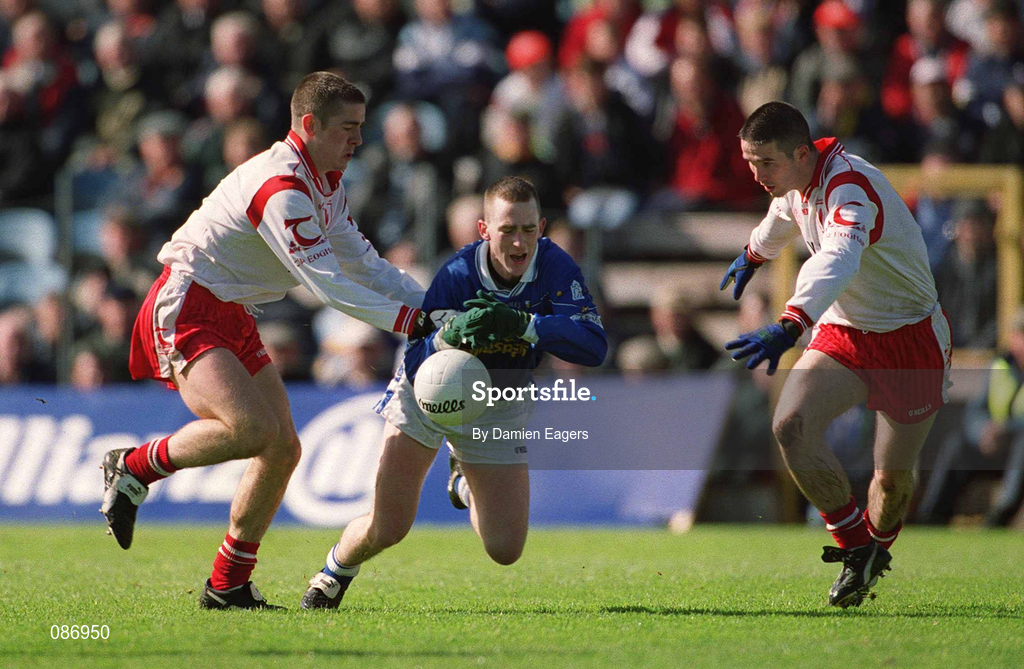 28 April 2002; Paul Galligan of Cavan in action against Philip Jordan, left, and Ciaran Gourley of Tyrone during the Allianz National Football League Division 1 Final match between Tyrone and Cavan at St Tiernach's Park in Clones, Monaghan. Photo by Damien Eagers/Sportsfile