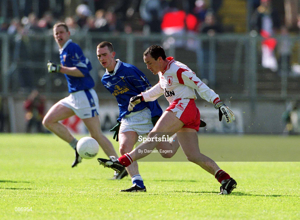 28 April 2002; Brian Dooher of Tyrone in action against Paul Galligan of Cavan during the Allianz National Football League Division 1 Final match between Tyrone and Cavan at St Tiernach's Park in Clones, Monaghan. Photo by Damien Eagers/Sportsfile