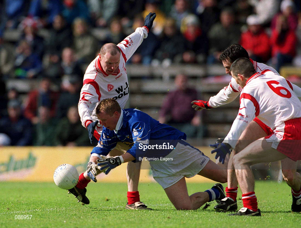 28 April 2002; Jason Reilly of Cavan in action against Chris Lawn, left, and Ciaran Gourley, 6, of Tyrone during the Allianz National Football League Division 1 Final match between Tyrone and Cavan at St Tiernach's Park in Clones, Monaghan. Photo by Damien Eagers/Sportsfile