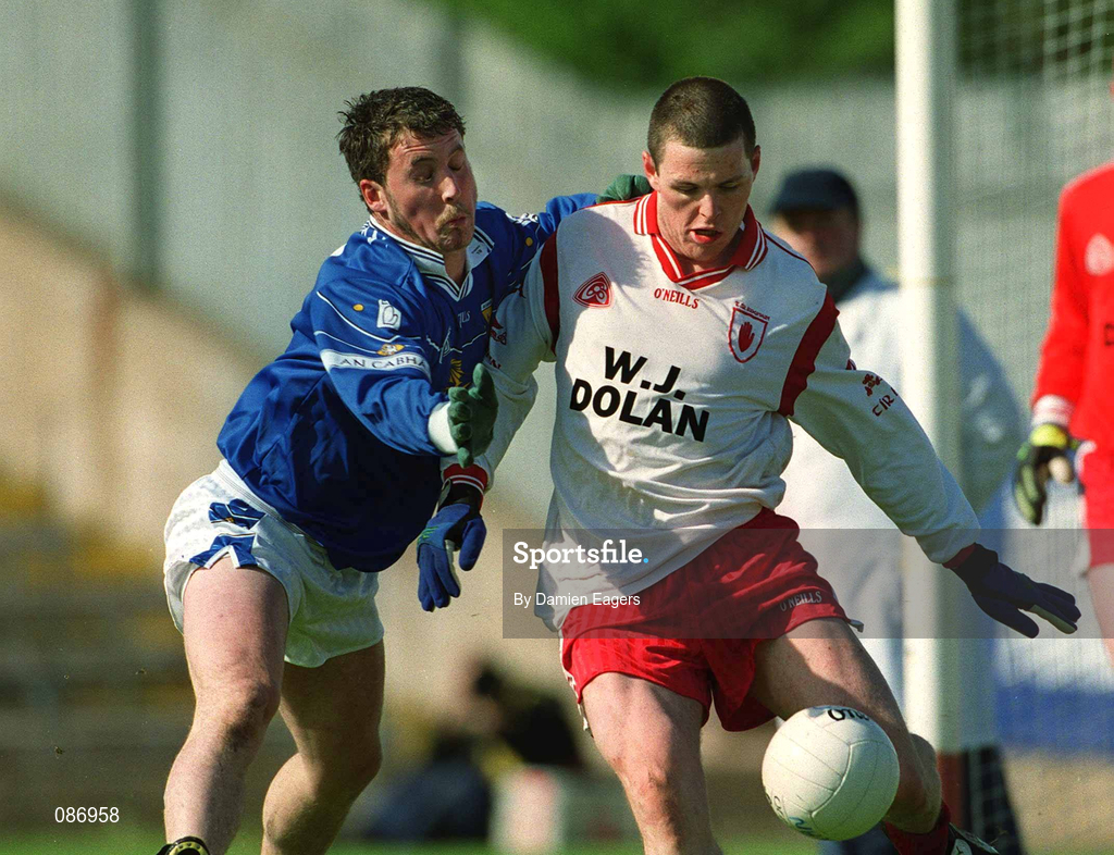 28 April 2002; Conor Gormley of Tyrone in action against Eddie Reilly of Cavan during the Allianz National Football League Division 1 Final match between Tyrone and Cavan at St Tiernach's Park in Clones, Monaghan. Photo by Damien Eagers/Sportsfile