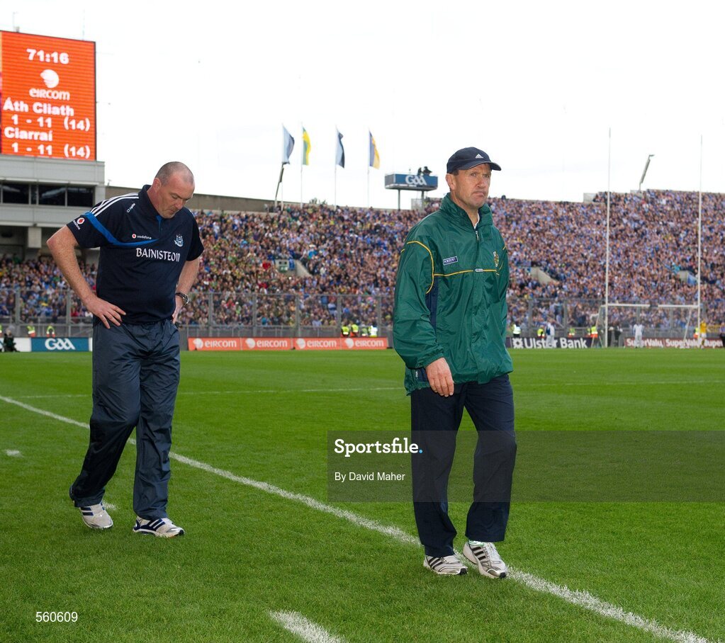 18 September 2011; Kerry manager Jack O'Connor walks past Dublin manager Pat Gilroy during the closing stages of the game with both teams tied at 14 points each. GAA Football All-Ireland Senior Championship Final, Kerry v Dublin, Croke Park, Dublin. Picture credit: David Maher / SPORTSFILE