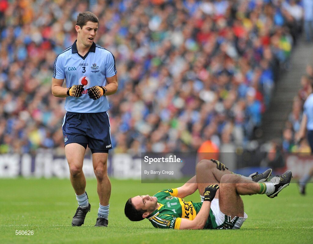 18 September 2011; Declan O'Sullivan, Kerry, holds his leg after being fouled by Rory O'Carroll, Dublin. GAA Football All-Ireland Senior Championship Final, Kerry v Dublin, Croke Park, Dublin. Picture credit: Barry Cregg / SPORTSFILE