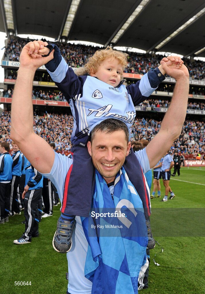 18 September 2011; Alan Brogan, Dublin, with his son Jamie, aged 2, celebrates victory after the game. GAA Football All-Ireland Senior Championship Final, Kerry v Dublin, Croke Park, Dublin. Picture credit: Ray McManus / SPORTSFILE