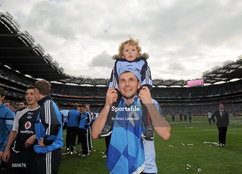 18 September 2011; Alan Brogan, Dublin, carries his son Jamie, aged 2, on his shoulders as he celebrates victory after the game. GAA Football All-Ireland Senior Championship Final, Kerry v Dublin, Croke Park, Dublin. Picture credit: Brian Lawless / SPORTSFILE