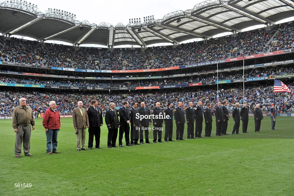 18 September 2011; Members of the New York Fire Department being with a member of the Artane School of Music band as they are presented to the crowd at half-time. GAA Football All-Ireland Senior Championship Final, Kerry v Dublin, Croke Park, Dublin. Picture credit: Barry Cregg / SPORTSFILE