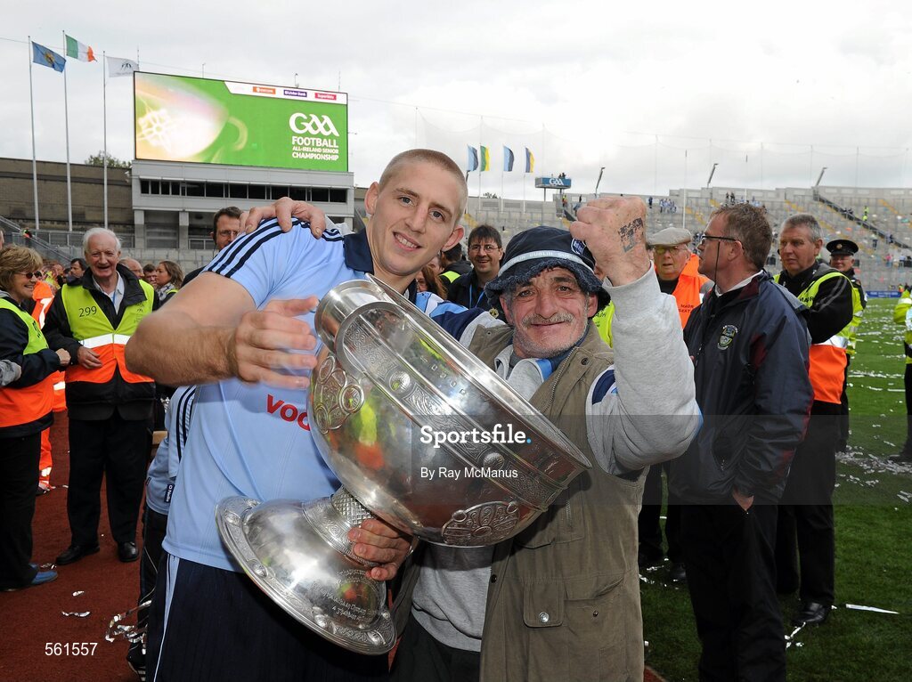 18 September 2011; Eoghan O'Gara, Dublin, celebrates with supporter Dublin Gerry and the Sam Maguire Cup after the game. GAA Football All-Ireland Senior Championship Final, Kerry v Dublin, Croke Park, Dublin. Picture credit: Ray McManus / SPORTSFILE