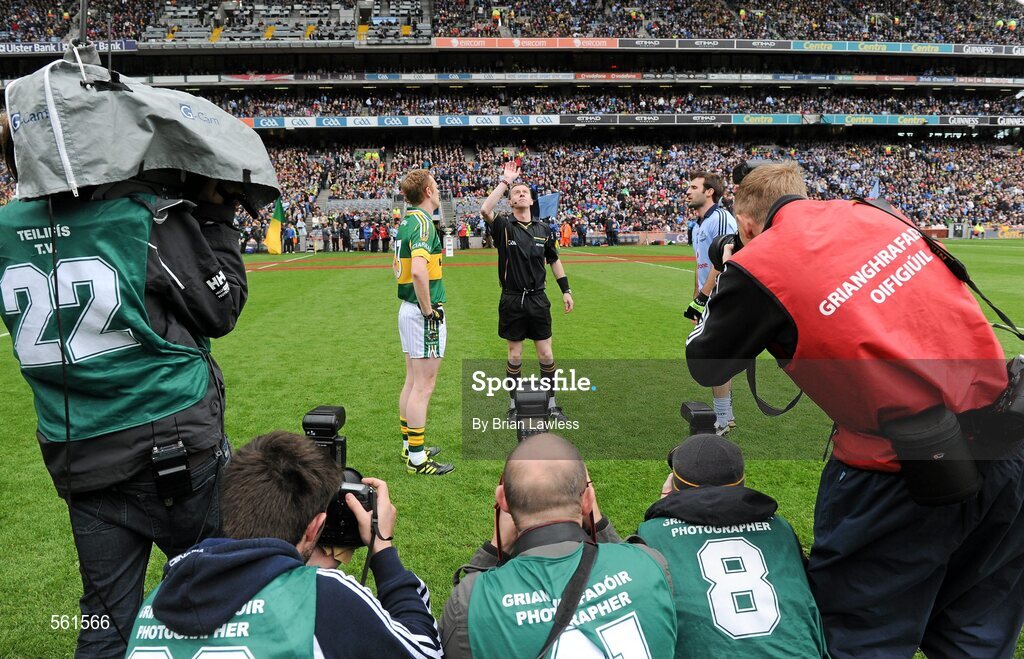 18 September 2011; Referee Joe McQuillan tosses the coin in the company of Dublin captain Bryan Cullen and Kerry captain Colm Cooper as photographers look on. GAA Football All-Ireland Senior Championship Final, Kerry v Dublin, Croke Park, Dublin. Picture credit: Brian Lawless / SPORTSFILE