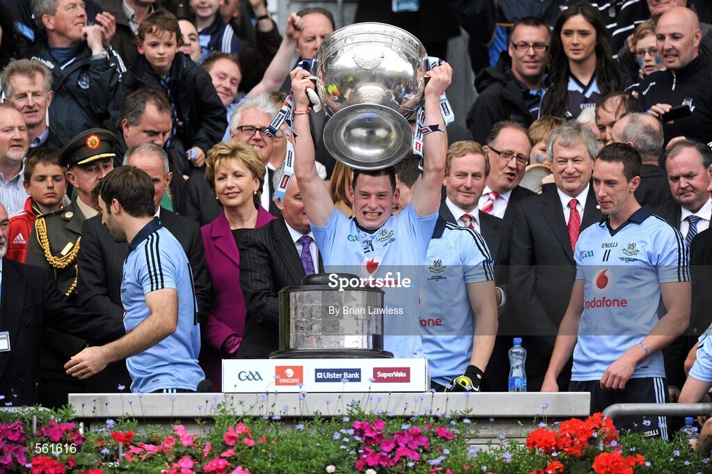 18 September 2011; Philip McMahon, Dublin, lifts the Sam Maguire as team-mate Barry Cahill waits his turn. GAA Football All-Ireland Senior Championship Final, Kerry v Dublin, Croke Park, Dublin. Picture credit: Brian Lawless / SPORTSFILE