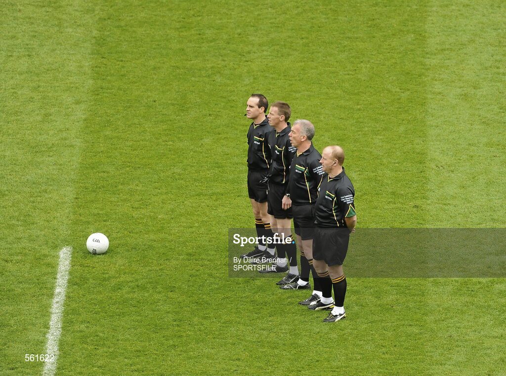 18 September 2011; Match Officials, from left to right, linesman David Coldrick, referee Joe McQuillan, linesman Pat McEnaney, and sideline official Maurice Condon, stand together for the National Anthem. GAA Football All-Ireland Senior Championship Final, Kerry v Dublin, Croke Park, Dublin. Picture credit: Dáire Brennan / SPORTSFILE