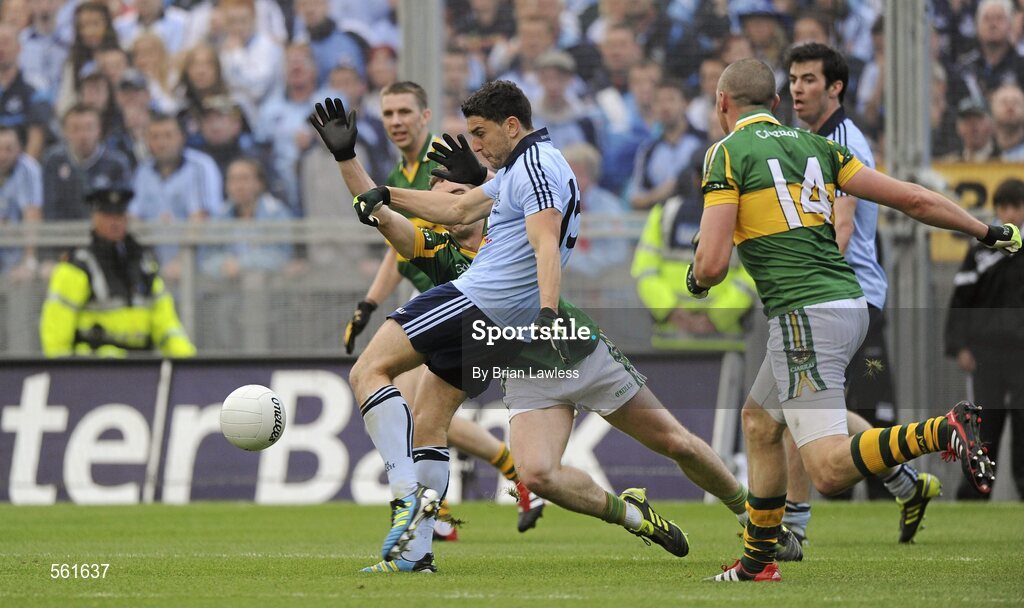 18 September 2011; Bernard Brogan, Dublin, kicks a late point despite the attention of Killian Young, Kerry. GAA Football All-Ireland Senior Championship Final, Kerry v Dublin, Croke Park, Dublin. Picture credit: Brian Lawless / SPORTSFILE