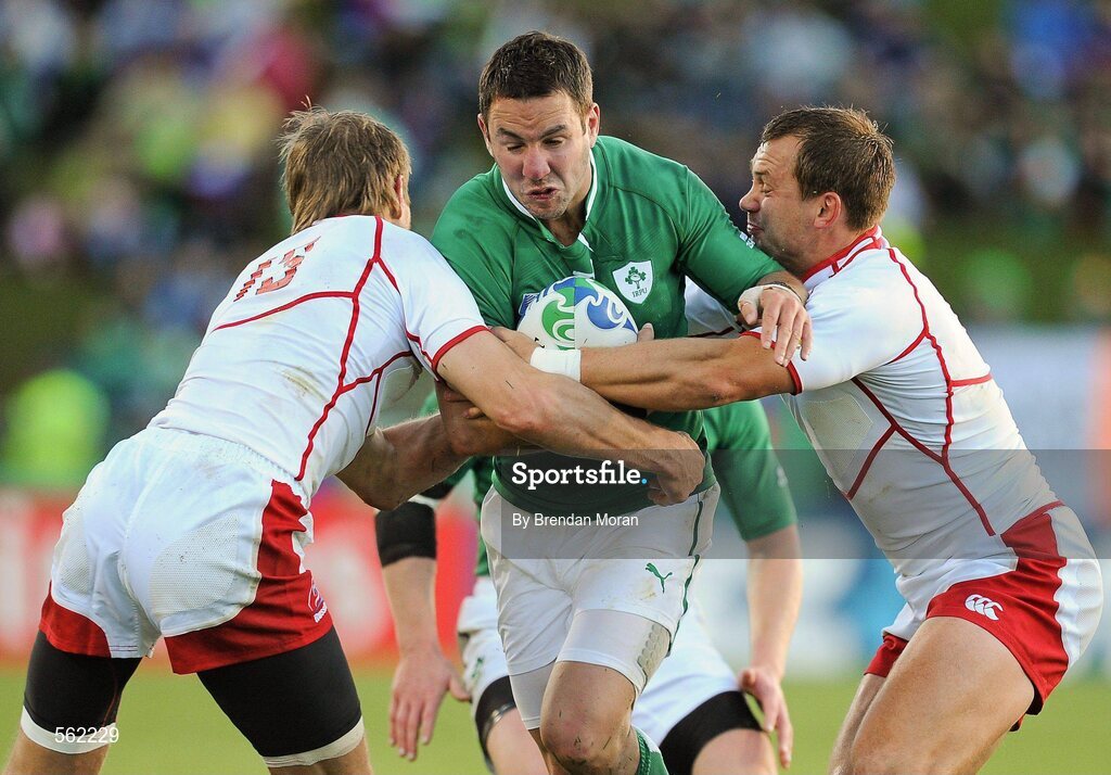25 September 2011; Paddy Wallace, Ireland, is tackled by Andrey Kuzin, left, and Konstantin Rachkov, Russia. 2011 Rugby World Cup, Pool C, Ireland v Russia, Rotorua International Stadium, Rotorua, New Zealand. Picture credit: Brendan Moran / SPORTSFILE