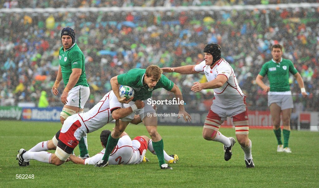 25 September 2011; Andrew Trimble, Ireland, is tackled by Artem Fatakhov, left, and Andrey Garbuzov, Russia. 2011 Rugby World Cup, Pool C, Ireland v Russia, Rotorua International Stadium, Rotorua, New Zealand. Picture credit: Brendan Moran / SPORTSFILE