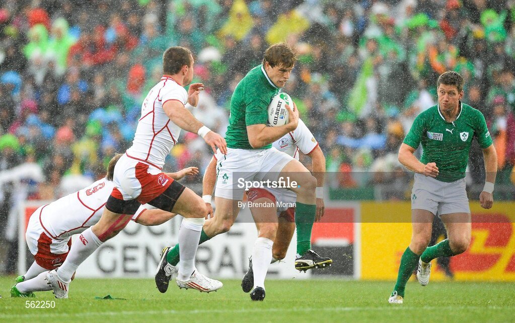 25 September 2011; Andrew Trimble, Ireland, supported by team-mate Ronan O'Gara, breaks through the Russia defence. 2011 Rugby World Cup, Pool C, Ireland v Russia, Rotorua International Stadium, Rotorua, New Zealand. Picture credit: Brendan Moran / SPORTSFILE