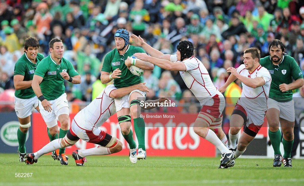 25 September 2011; Jamie Healsip, Ireland, is tackled by Adam Byrnes, left, and Andrey Garbuzov, Russia. 2011 Rugby World Cup, Pool C, Ireland v Russia, Rotorua International Stadium, Rotorua, New Zealand. Picture credit: Brendan Moran / SPORTSFILE