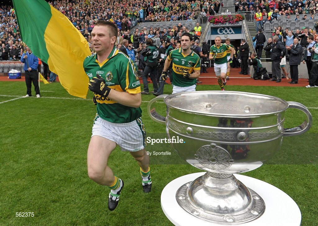 18 September 2011; Tomas O Se, Kerry, runs out on to the pitch past the Sam Maguire cup, followed by team-mate Bryan Sheehan. GAA Football All-Ireland Senior Championship Final, Kerry v Dublin, Croke Park, Dublin. Photo by Sportsfile
