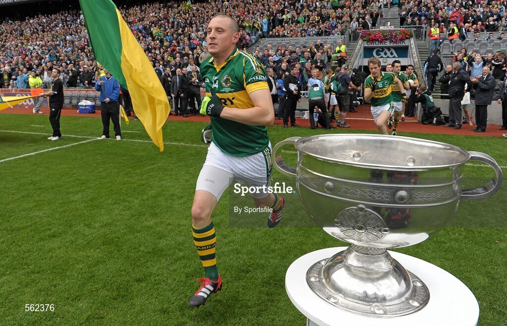 18 September 2011; Kieran Donaghy, Kerry, runs out on to the pitch past the Sam Maguire cup. GAA Football All-Ireland Senior Championship Final, Kerry v Dublin, Croke Park, Dublin. Photo by Sportsfile