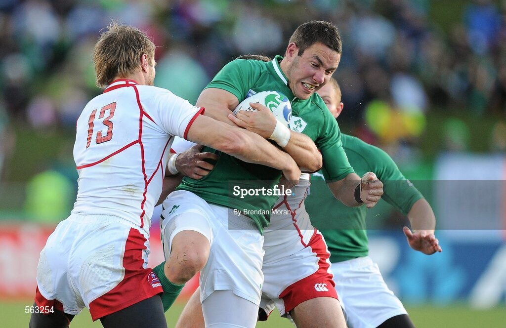 25 September 2011; Paddy Wallace, Ireland, is tackled by Andrey Kuzin, left, and Konstantin Rachkov, Russia. 2011 Rugby World Cup, Pool C, Ireland v Russia, Rotorua International Stadium, Rotorua, New Zealand. Picture credit: Brendan Moran / SPORTSFILE