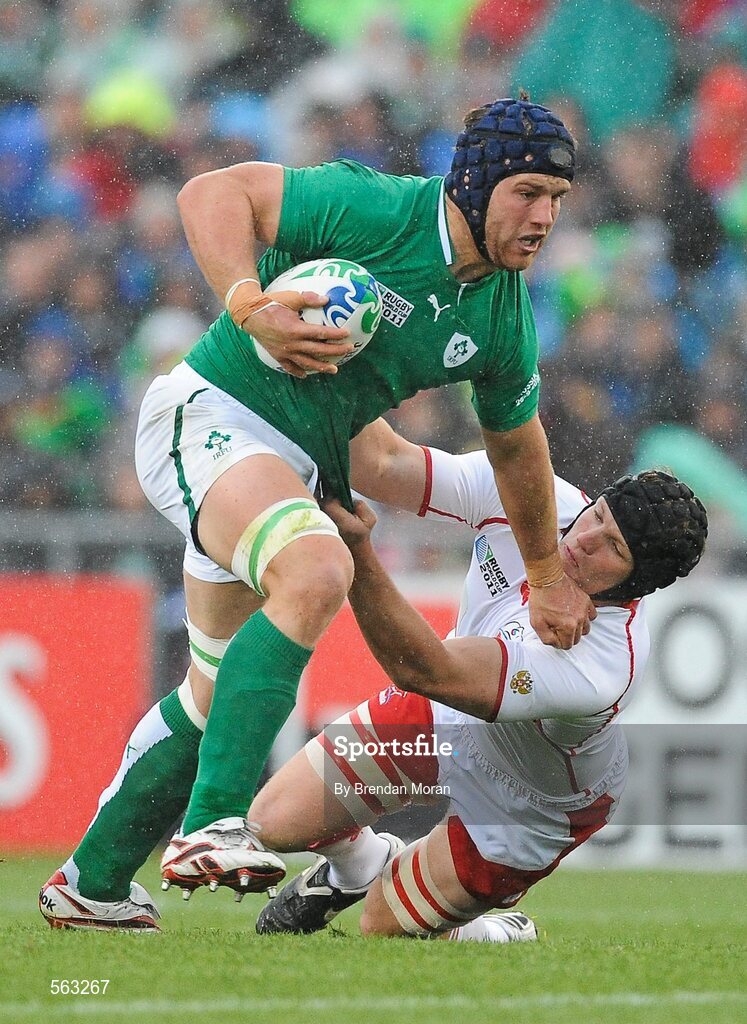 25 September 2011; Sean O'Brien, Ireland, holds off the tackle of Andrey Garbuzov, Russia. 2011 Rugby World Cup, Pool C, Ireland v Russia, Rotorua International Stadium, Rotorua, New Zealand. Picture credit: Brendan Moran / SPORTSFILE