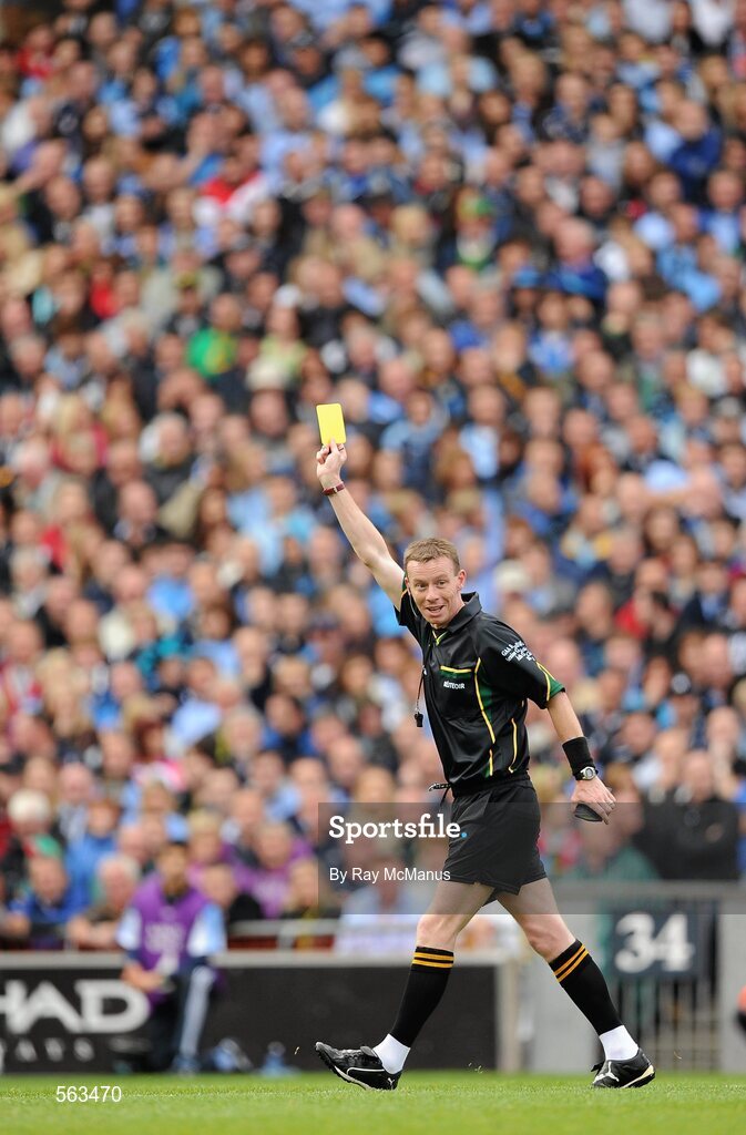 18 September 2011; Referee Joe McQuillan shows a yellow card. GAA Football All-Ireland Senior Championship Final, Kerry v Dublin, Croke Park, Dublin. Picture credit: Ray McManus / SPORTSFILE