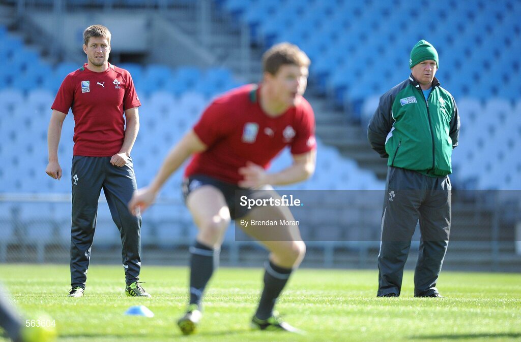 28 September 2011; Ireland out-half Ronan O'Gara and head coach Declan Kidney watch Brian O'Driscoll in action during squad training ahead of their 2011 Rugby World Cup, Pool C, game against Italy on Sunday. Ireland Rugby Squad Training, Carisbrook Stadium, Dunedin, New Zealand. Picture credit: Brendan Moran / SPORTSFILE