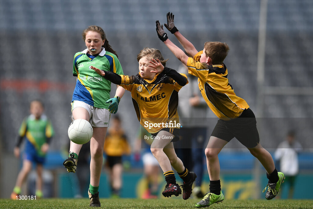 12 April 2017; Rachel Dolan, representing St Brigids GAA Club, Co Roscommon, in action against Joseph O'Kane, centre, and Cormac O'Malley, representing Enniscrone Kilglass GAA Club, Co Sligo, during The Go Games Provincial Days in partnership with Littlewoods Ireland Day 3 at Croke Park in Dublin. Photo by Cody Glenn/Sportsfile