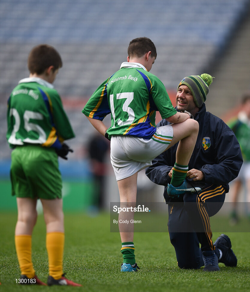 12 April 2017; James Glancy takes a break from referee duties to tie the shoe laces of Francis McGirl, representing St Brigids GAA Club, Co Sligo, during The Go Games Provincial Days in partnership with Littlewoods Ireland Day 3 at Croke Park in Dublin. Photo by Cody Glenn/Sportsfile