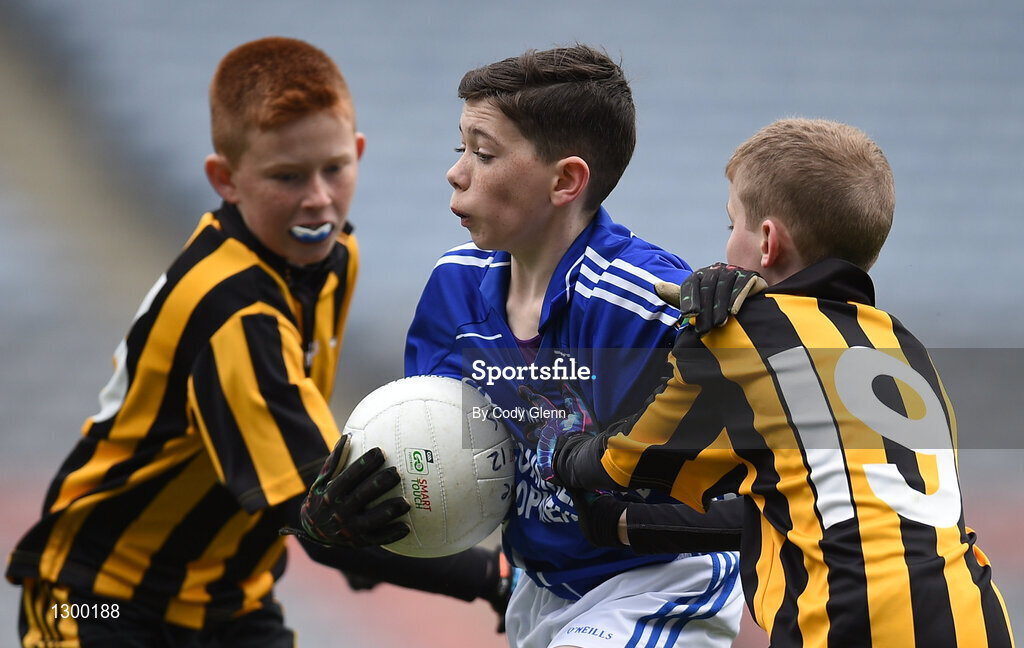 12 April 2017; , Dion Lane, representing St Ronans GAA Club, Co Roscommon, in action against Cormac Conan, left, and Kevin Speakart, representing Parke Keelogues Crimlin GAA Club, Co Mayo, during The Go Games Provincial Days in partnership with Littlewoods Ireland Day 3 at Croke Park in Dublin. Photo by Cody Glenn/Sportsfile