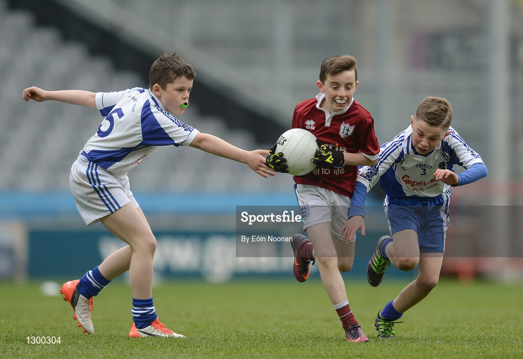 13 April 2017; Aaron Duggan representing Balla GAA Club, Co. Mayo, in action against left, Gareth Barry and right, Bobby Hanrahan representing St Marys Kiltoghert GAA Club, Co. Leitrim, during the Go Games Provincial Days in partnership with Littlewoods Ireland Day 4 at Croke Park in Dublin. Photo by Eóin Noonan/Sportsfile