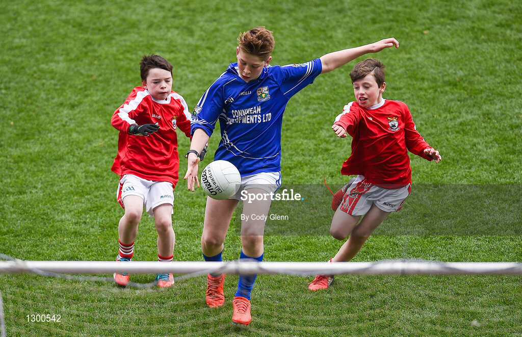 12 April 2017; Caolan O'Connor, representing St. Ronan's GAA Club, Co Roscommon, scores a goal despite the attempts of Shane O'Loughlin, left, and Eoghan Healy, representing Coolera Strandhill GAA Club, Co Sligo, during the The Go Games Provincial Days in partnership with Littlewoods Ireland Day 3 at Croke Park in Dublin. Photo by Cody Glenn/Sportsfile