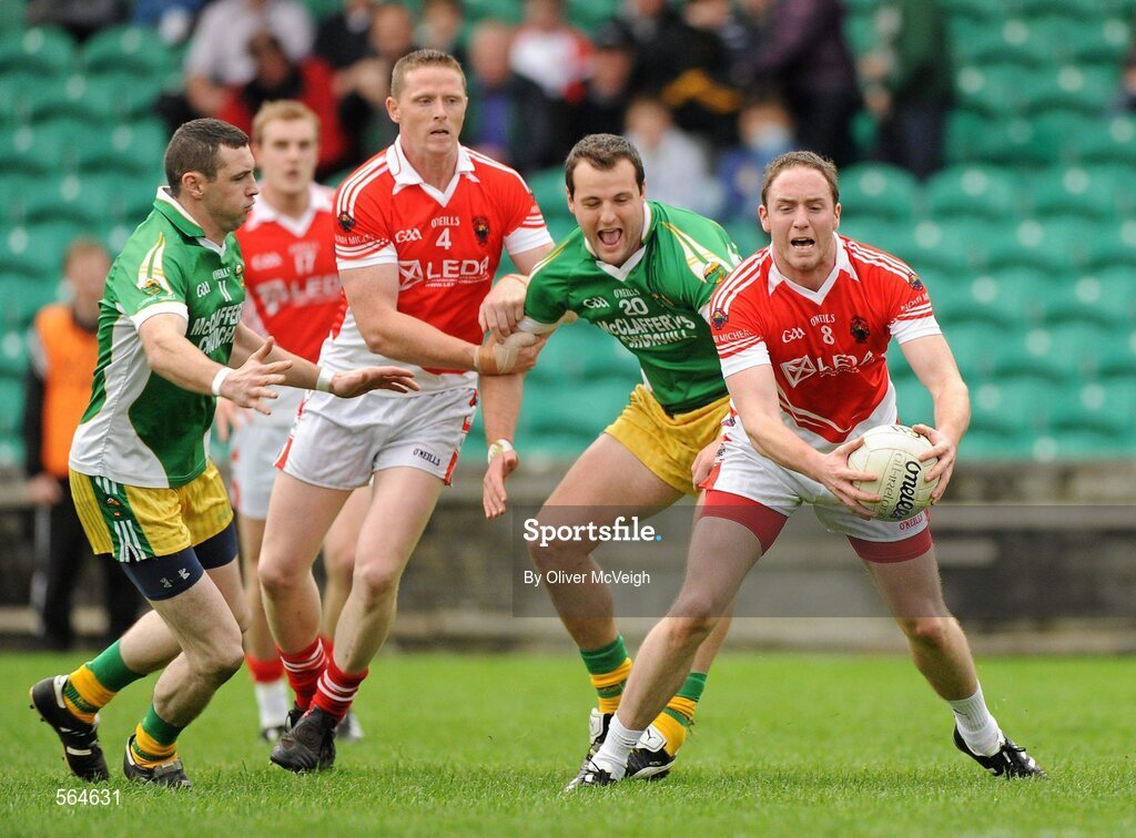2 October 2011; Ciaran Gallagher, St. Michael's, supported by team-mate Stephen Black in action against Michael Murphy and Cian Bonner, left, Glenswilly. Radio Na Gaeltachta Donegal County Senior Football Championship Final, Glenswilly v St. Michael's, MacCumhaill Park, Ballybofey, Co. Donegal. Picture credit: Oliver McVeigh / SPORTSFILE