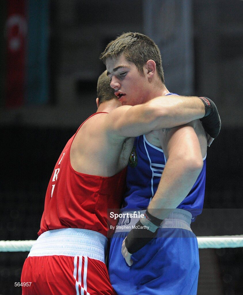 4 October 2011; Joe Ward, Moate B.C., Westmeath, representing Ireland, right, is consoled by Ehsan Rouzbahani, Iran, following their 81kg bout. Ward was defeated on countback after the bout ended 15-15. 2011 AIBA World Boxing Championships - Last 16, Joe Ward v Ehsan Rouzbahani. Heydar Aliyev Sports and Exhibition Complex, Baku, Azerbaijan. Picture credit: Stephen McCarthy / SPORTSFILE