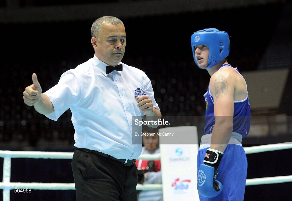 4 October 2011; Referee Bahodir Jumaniyazov, Uzbekistan, issues a two-point penalty to Joe Ward, Moate B.C., Westmeath, representing Ireland, during his 81kg bout with Ehsan Rouzbahani, Iran. Ward was defeated on countback after the bout ended 15-15. 2011 AIBA World Boxing Championships - Last 16, Joe Ward v Ehsan Rouzbahani. Heydar Aliyev Sports and Exhibition Complex, Baku, Azerbaijan. Picture credit: Stephen McCarthy / SPORTSFILE