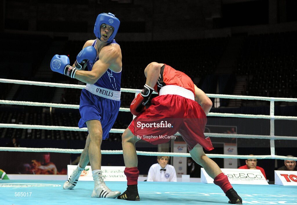 4 October 2011; Darren O'Neill, Paulstown B.C., Kilkenny, representing Ireland, left, exchanges punches with Mladen Manev, Bulgaria, during their 75kg bout. O'Neill's 19-12 victory ensured progression to the Quarter-Finals and also qualification for the London 2012 Olympic Games. 2011 AIBA World Boxing Championships - Last 16, Darren O'Neill v Mladen Manev. Heydar Aliyev Sports and Exhibition Complex, Baku, Azerbaijan. Picture credit: Stephen McCarthy / SPORTSFILE
