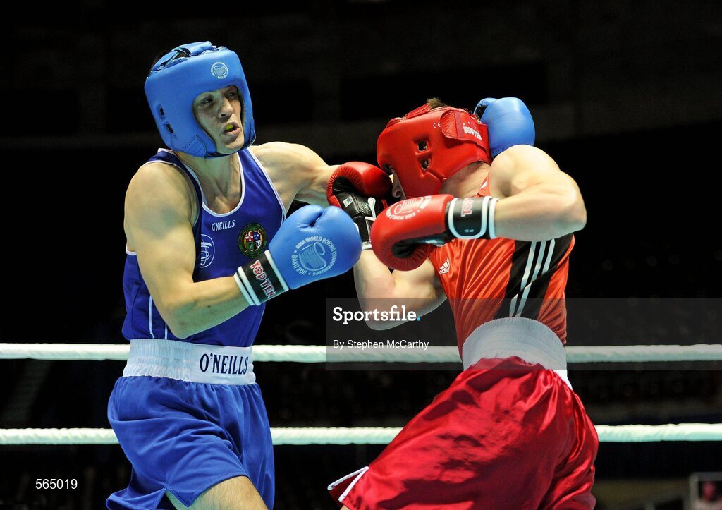 4 October 2011; Darren O'Neill, Paulstown B.C., Kilkenny, representing Ireland, left, exchanges punches with Mladen Manev, Bulgaria, during their 75kg bout. O'Neill's 19-12 victory ensured progression to the Quarter-Finals and also qualification for the London 2012 Olympic Games. 2011 AIBA World Boxing Championships - Last 16, Darren O'Neill v Mladen Manev. Heydar Aliyev Sports and Exhibition Complex, Baku, Azerbaijan. Picture credit: Stephen McCarthy / SPORTSFILE