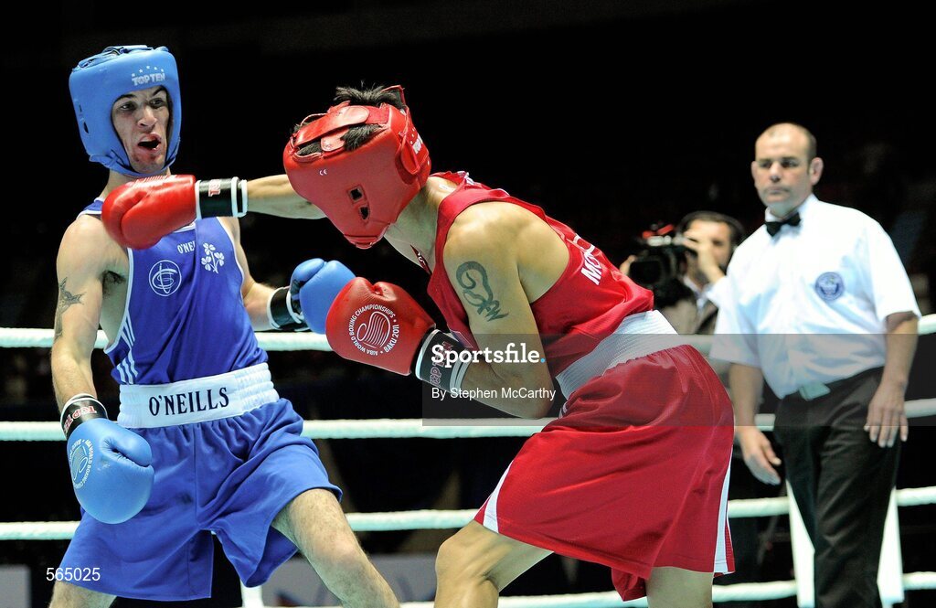 4 October 2011; John Joe Nevin, Cavan B.C., representing Ireland, left, exchanges punches with Otgondalai Dorjnyambuu, Mongolia, during their 56kg bout. Nevin won the contest on countback after the bout ended 18-18. Nevin's victory ensured progression to the Quarter-Finals and also qualification for the London 2012 Olympic Games. 2011 AIBA World Boxing Championships - Last 16, John Joe Nevinl v Otgondalai Dorjnyambuu. Heydar Aliyev Sports and Exhibition Complex, Baku, Azerbaijan. Picture credit: Stephen McCarthy / SPORTSFILE